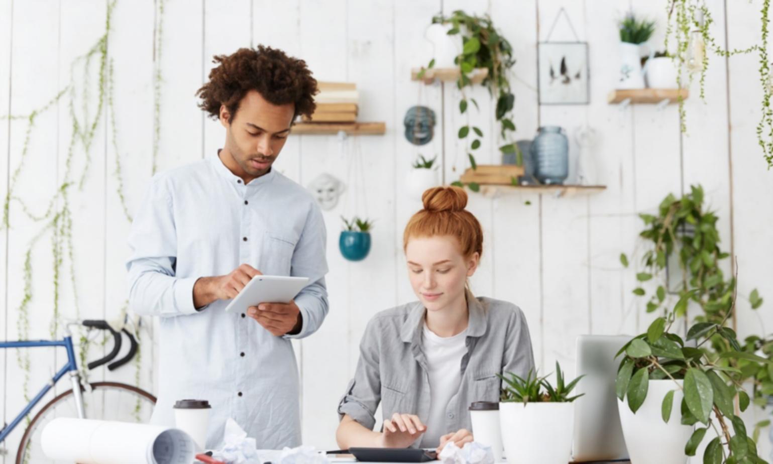Success story graduate reviewing their improved financial portfolio with confidence